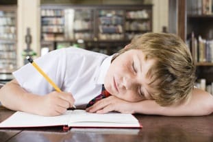 Child Falling Asleep on Homework